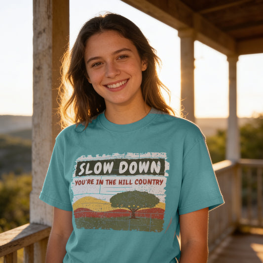 Seafoam Comfort Colors 1717 tee with Slow Down, You're in the Hill Country design, lifestyle on porch